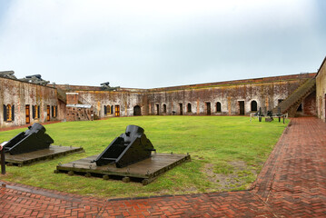 brick walls of Fort Macon and Civil War era cannons. in a national park in North Carolina - obrazy, fototapety, plakaty