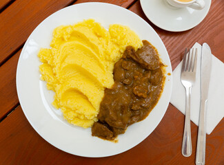 Liver goulash with gravy and mashed potatoes. Russian cuisine