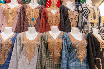 Traditional women's dresses in the Tunis souk.
