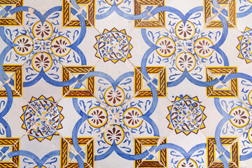 Yellow and blue decorative tiles on a house near the Tunis Souk.