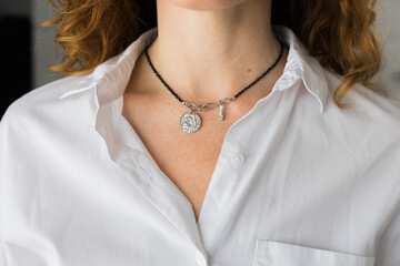 Female with silver pendant close-up. Image for e-commerce, online selling, social media, jewelry...