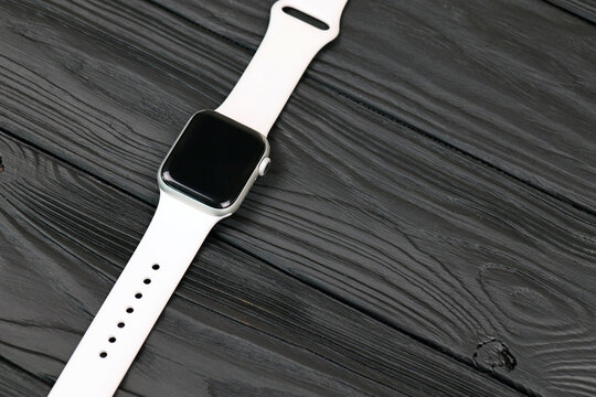 KYIV, UKRAINE - 4 MAY, 2023: Apple Watch series five 5 on black background close up