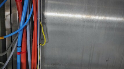 A bundle of blue and red cable in production room of factory