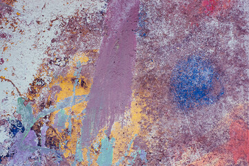 colored background, in the photo there are strokes of paint on a concrete wall
