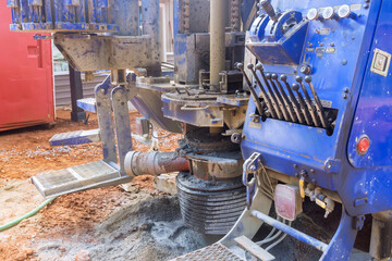 Land when ground water hole drilling machine for water flowing artesian well from water supply.