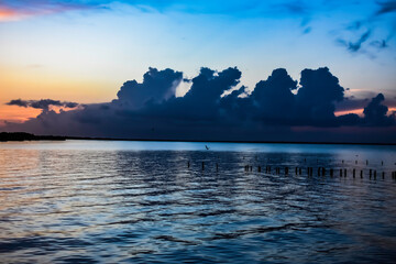 orange clouds at sunrise over the lake