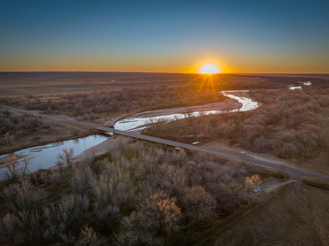 sunset over prairie and the South Platte River in eastern Colorado near Crook, aerial view of late November scenery