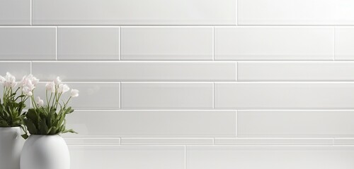A glossy white ceramic tile wall.