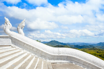 Detailed view of the stairs and dragon statue in front of the entrance to the Phuket's largest...