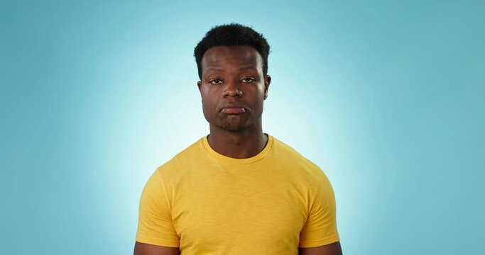 Face, shrug and black man with questions, confused and body language with choice on a blue background. Portrait, African person and model with reaction, expression and why with doubt, emoji or review