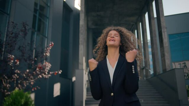 Happy excited amazed Caucasian young woman business lady girl celebrate good news rejoice shout achievement scream amazing opportunity wow get job female businesswoman winner dancing in city outdoors