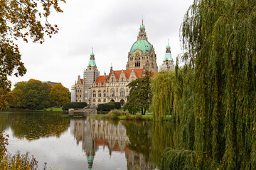 New City Hall in Hannover, Germany. Reflection in the water, trees (willows) near the lake