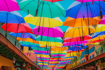 Fototapeta na wymiar Colorful umbrellas in a magical town of colombia.