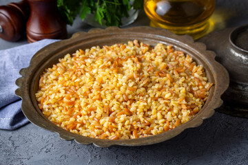 Traditional delicious Turkish food, bulgur pilaf with vermicelli (Turkish name; arpa sehriyeli bulgur pilavi)
