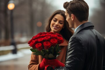 A happy woman accepts a bouquet of flowers from her beloved man on a date. Background with...