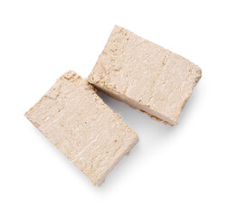 Pieces of tasty halva isolated on white, top view