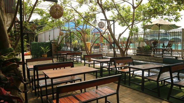 outside cafe seating area with wooden chair and table