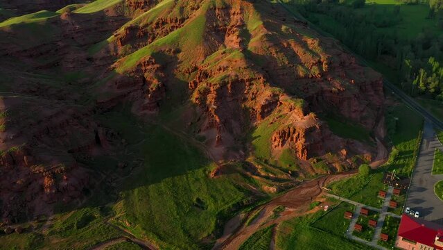 Aerial view of fairy chimneys and rock formations in Narman district of Erzurum province and the social facility next to them
