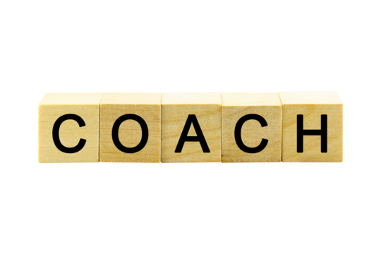 "COACH" text or message short word english letter on a small wooden cubes block with white background.