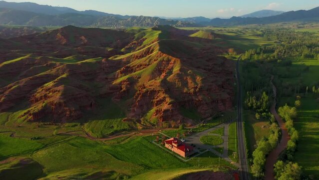 Aerial view of fairy chimneys and rock formations in Narman district of Erzurum province and the social facility next to them