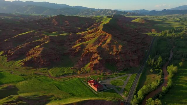 Aerial view of fairy chimneys and rock formations in Narman district of Erzurum province and the social facility next to them