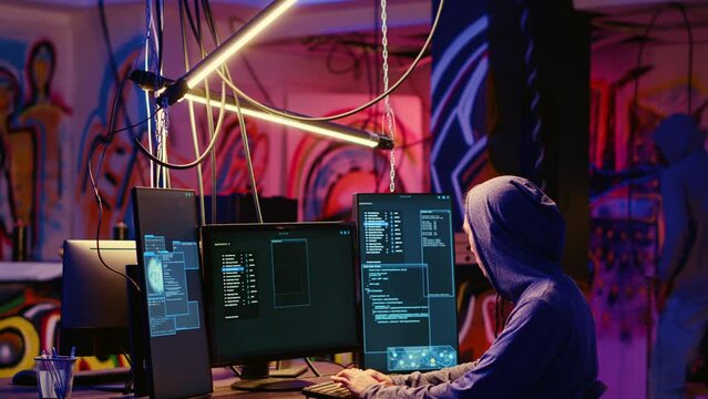 Hackers in underground hideout discussing technical knowhow details before using bugs and exploits to break into computer systems and access valuable data, finding best approach to bypass firewalls