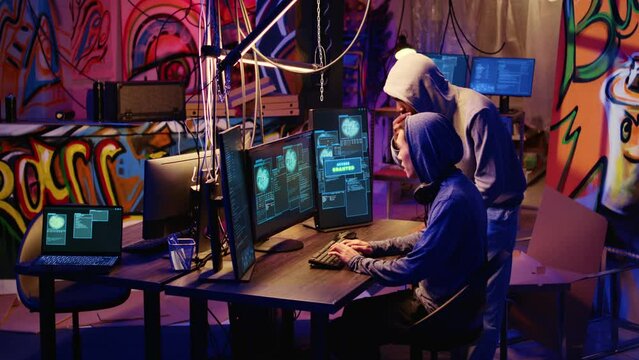 Hackers in hidden base excited after successfully getting past anti tamper measures implemented by companies to protect their products. Crackers happy after pirating software and video game releases