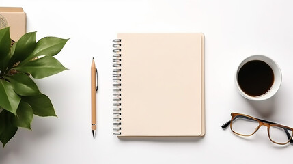 top view of modern workspace with open notebook and coffee cup on white desk
