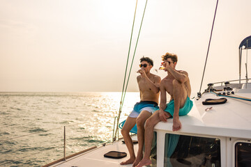 Caucasian men friend drinking champagne while having party in yacht.