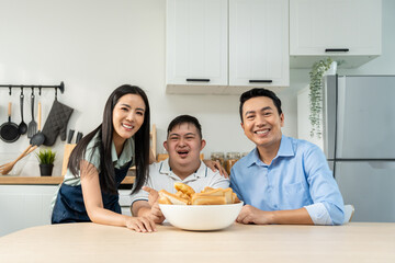 Asian happy family, mature parents baking bakery with son in kitchen. 