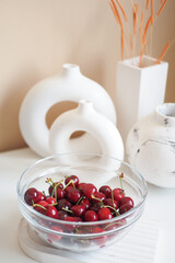 ripe fresh cherry in a bowl on table 