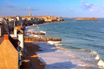 Sunny aerial view of beautiful walled port city of Saint-Malo at high tide, Brittany, France - obrazy, fototapety, plakaty