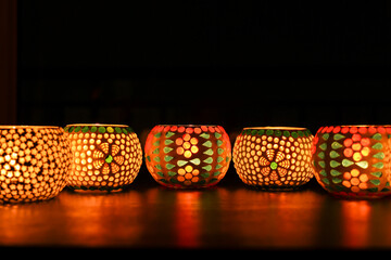 Diwali celebration Indian festival of lights Diya oil lamp lantern. Colors Rangoli decoration...