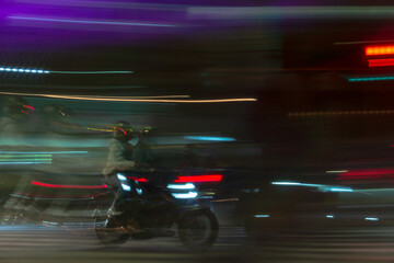 motorcycle with rider moving through traffic