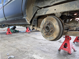 replacing wheels on a car, jack holds the body of the car