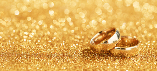 golden rings on gold bokeh background
