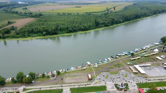 Aerial footage of small boats on Tisza river in Novi Becej, Serbia
