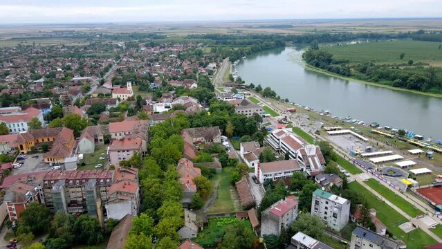 Streets of town Novi Becej and Tisza river viewed from bird's-eye view