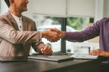 Two professionals in meeting, one presenting "Business, Plan, Success" on whiteboard, another observing and holding a clipboard. Asian businessman, Colleagues, Middle-age