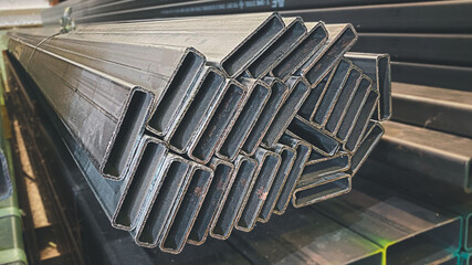 Metal profile pipe of rectangular cross section in packs at the warehouse of metal products
