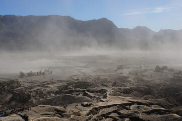Misty morning with sandstorm in the mount Bromo, Indonesia