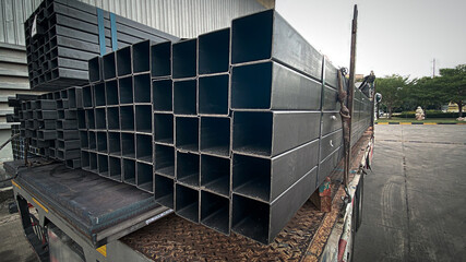 Metal profile pipe of rectangular cross section in packs at the warehouse of metal products