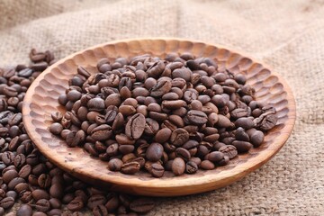 A coffee bean is a fruit from the Coffea plant and the source for coffee. It is the pip inside the red or purple fruit. 