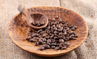 A coffee bean is a fruit from the Coffea plant and the source for coffee. It is the pip inside the red or purple fruit. 