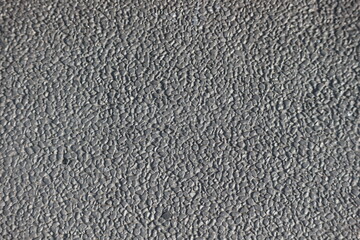 Fill in a photo frame of a neatly arranged rough concrete wall, suitable for a house facade.