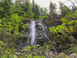 AJ falls, waterfall on East Glacier Trail, in Mendenhall Glacier Recreation Area of the Tongass National Forest, near Juneau, Alaska. Manmade waterfalls, created during the gold rush. 