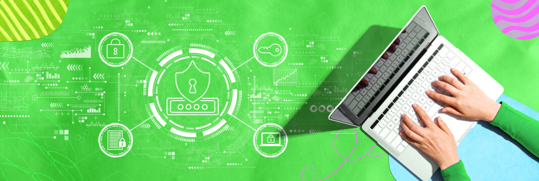 Cyber security theme with person using a laptop computer