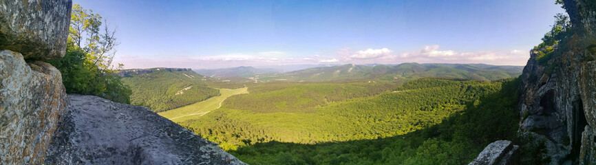 Mangup-Kale cave city, sunny day. Mountain view from the ancient cave town of Mangup-Kale in the Republic of Crimea, Russia. Bakhchisarai.