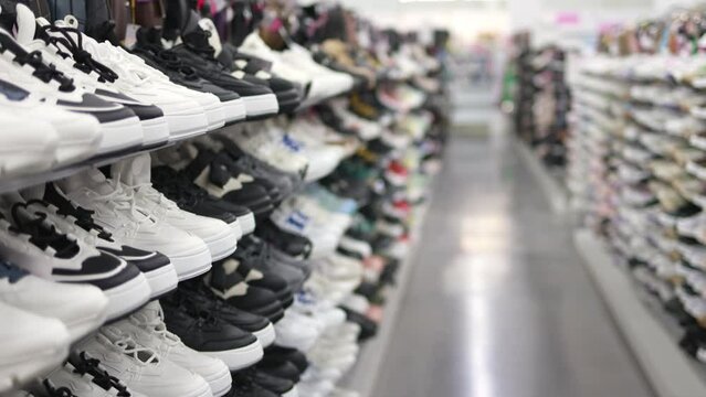 Shelves with sneakers in a store.