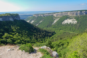 Mangup-Kale cave city, sunny day. Mountain view from the ancient cave town of Mangup-Kale in the Republic of Crimea, Russia. Bakhchisarai.